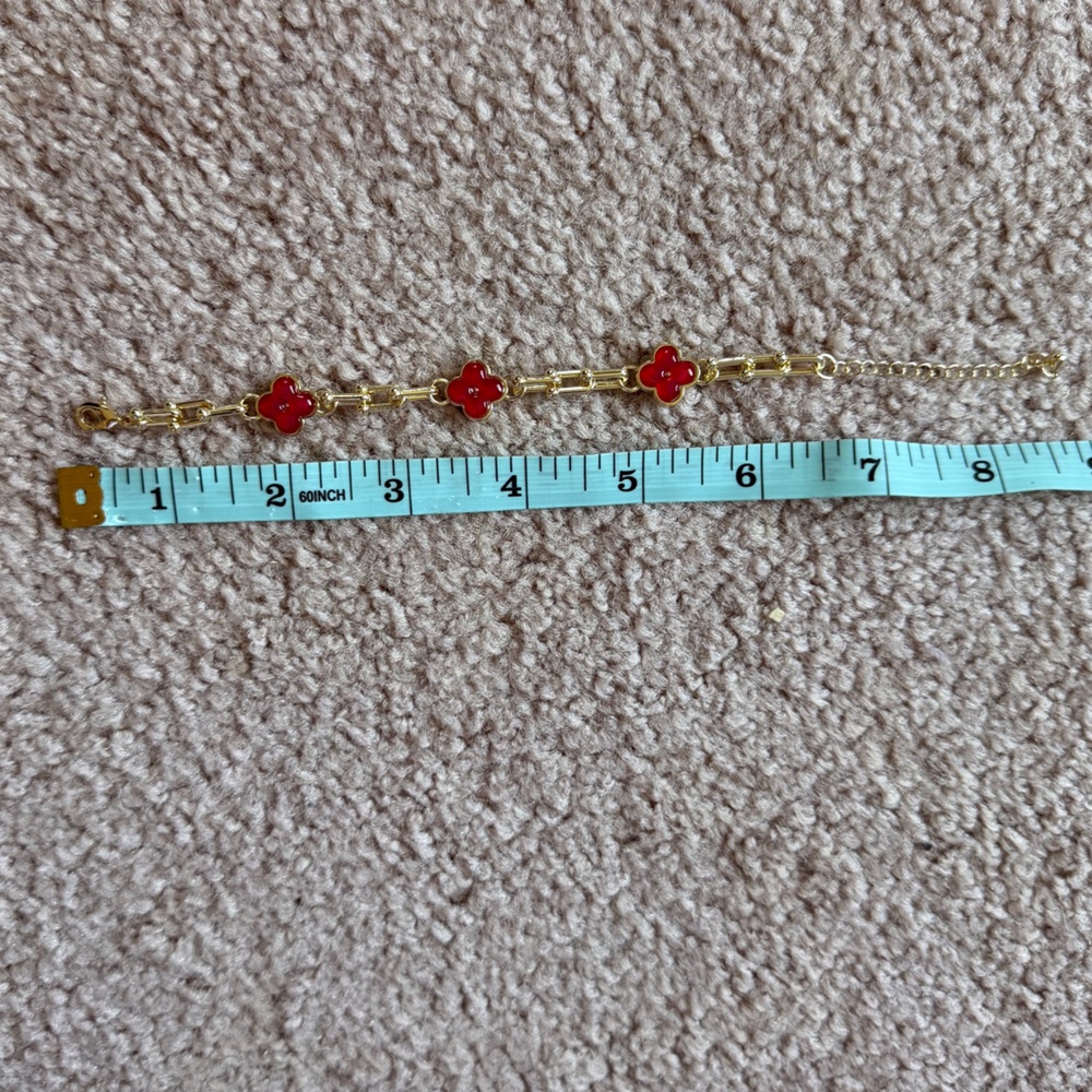 Gold Bracelet with Red Clover Accents